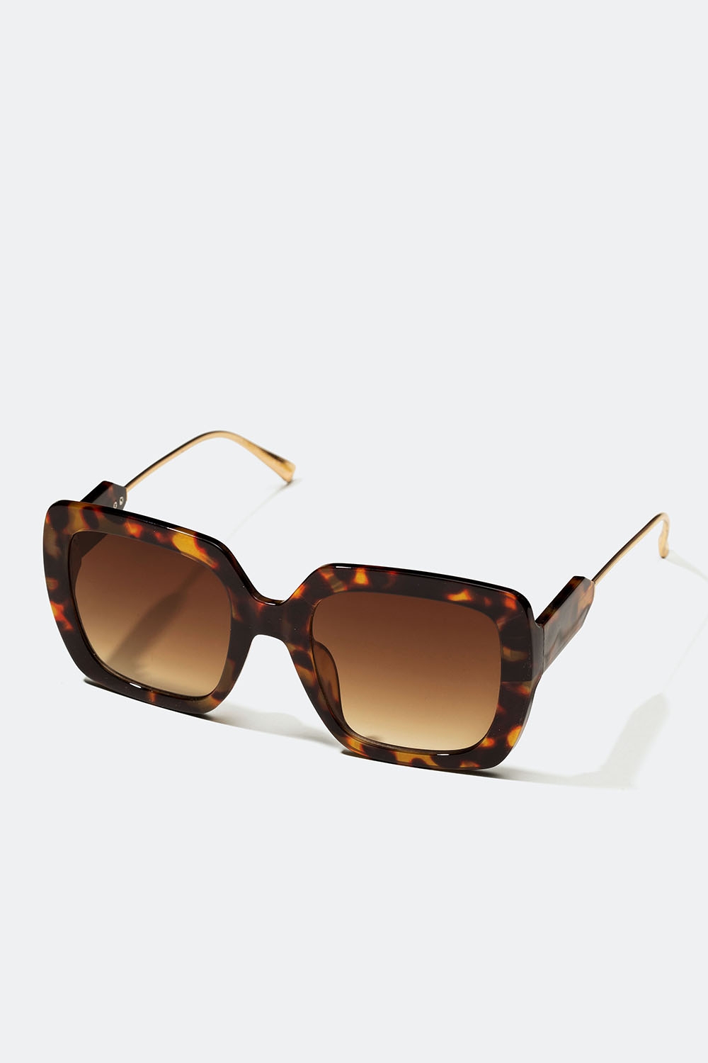 Bruna oversize solglasögon med guldfärgade skalmar i gruppen Accessoarer / Solglasögon hos Glitter (176001158400)