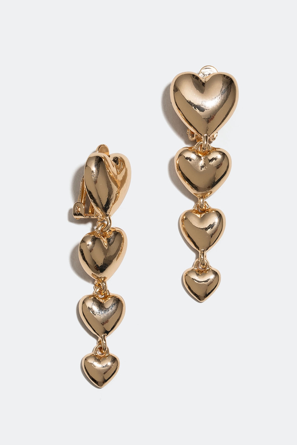 Clipsörhängen med hängande guldfärgade hjärtan i gruppen Smycken / Örhängen / Clips hos Glitter (253005442002)