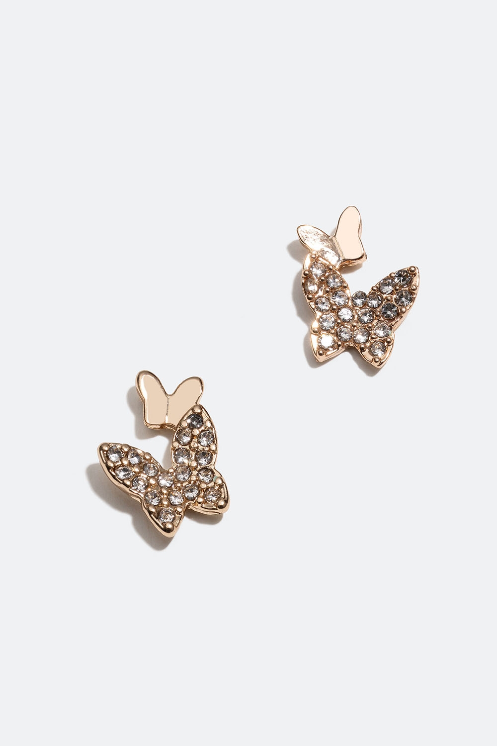 Små guldfärgade örhängen med fjärilar och glasstenar i gruppen Smycken / Örhängen / Studs hos Glitter (253005720202)