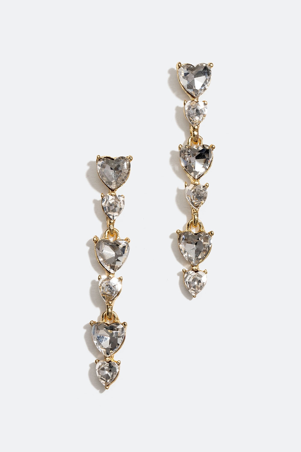 Långa guldfärgade örhängen med hjärtformade glasstenar i gruppen Smycken / Örhängen hos Glitter (253005840202)