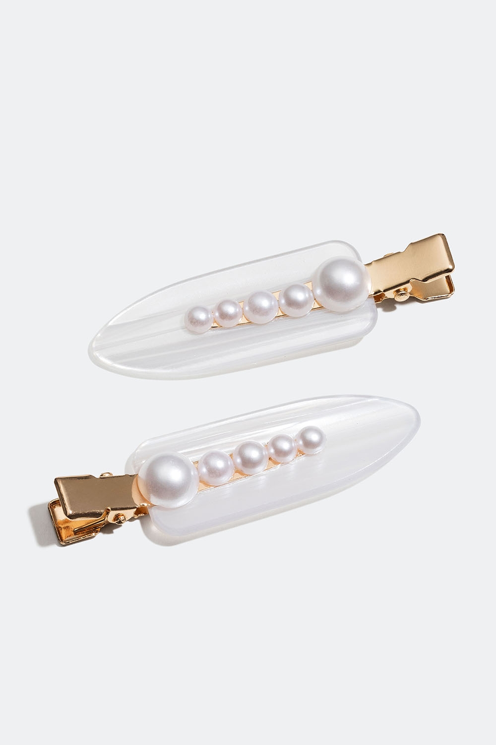 Guldfärgade hårspännen med vita pärlor, 2-pack i gruppen Håraccessoarer / Spännen & klämmor / Hårspännen hos Glitter (335001173100)