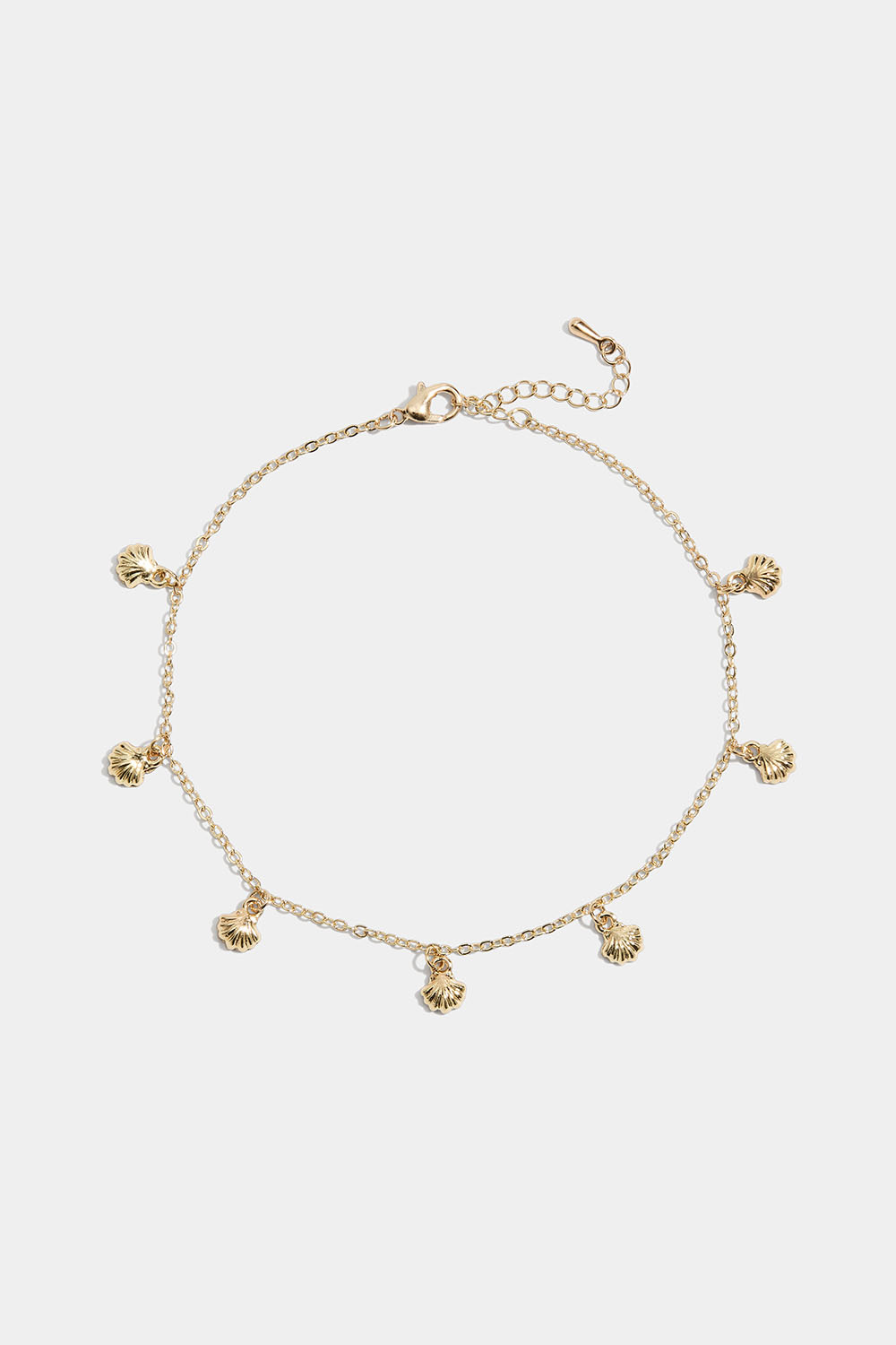 Guldfärgad fotlänk med snäckor