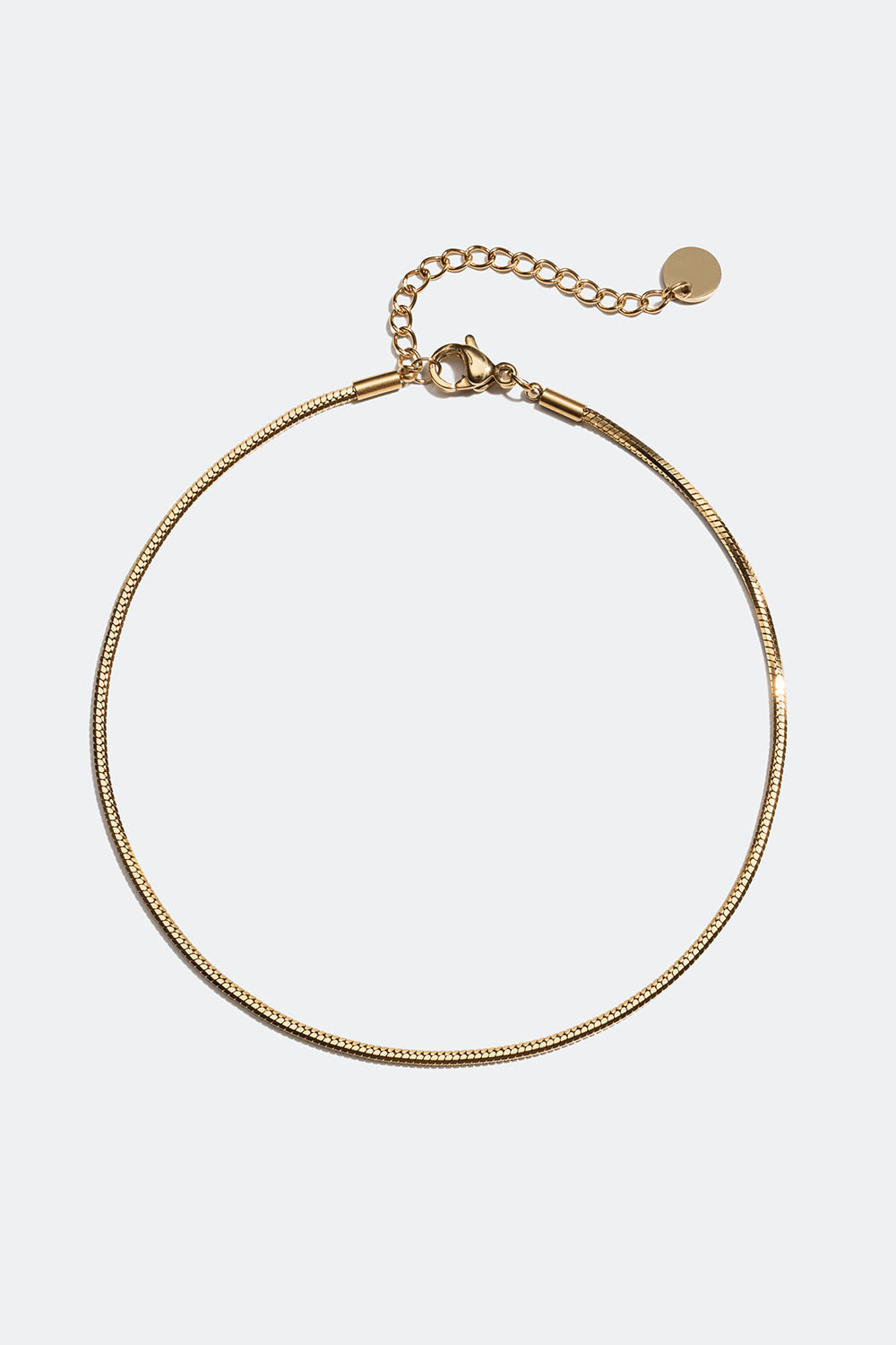 Fotlänk i stål med 18k guld med rundad ormkedja